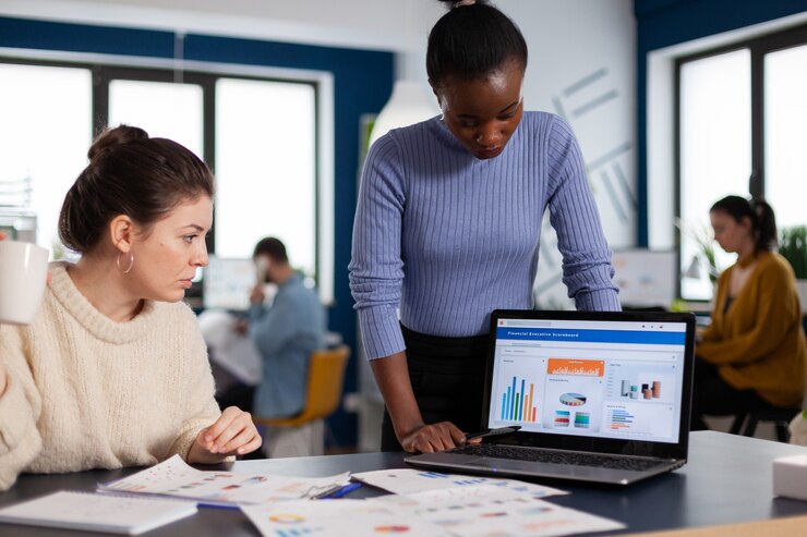 Professional team managing campaigns at a Google Ads agency in Saudi Arabia, optimizing ad performance on a computer screen.